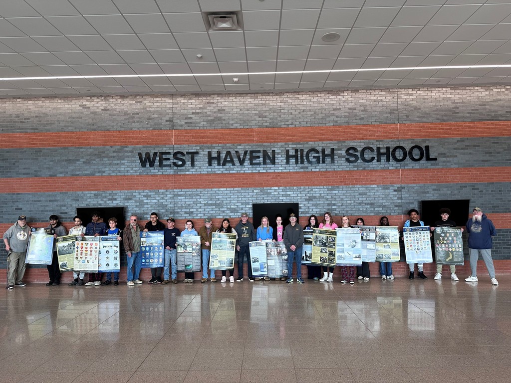 West Haven Vietnam Veterans and Students of the West Haven High School U.S. History class display the United States of America Vietnam War Veterans Commemoration Poster Series